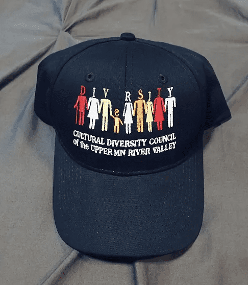 A black hat with the words " diversity council of the upper new river valley ".